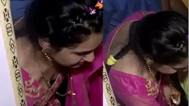 Beauty?s Cleavage Clicked by Neighbour Boy in Function