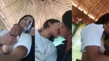 A guy presses a girl?s boobs outdoors in the local sex video